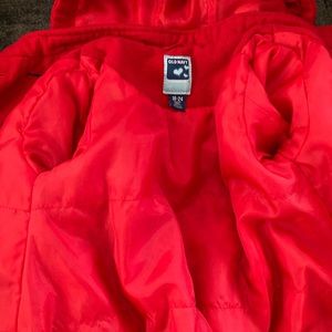 A toddler red coat
